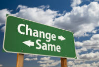 Change, Same Green Road Sign Over Dramatic Clouds and Sky.