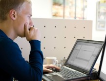 man working at laptop